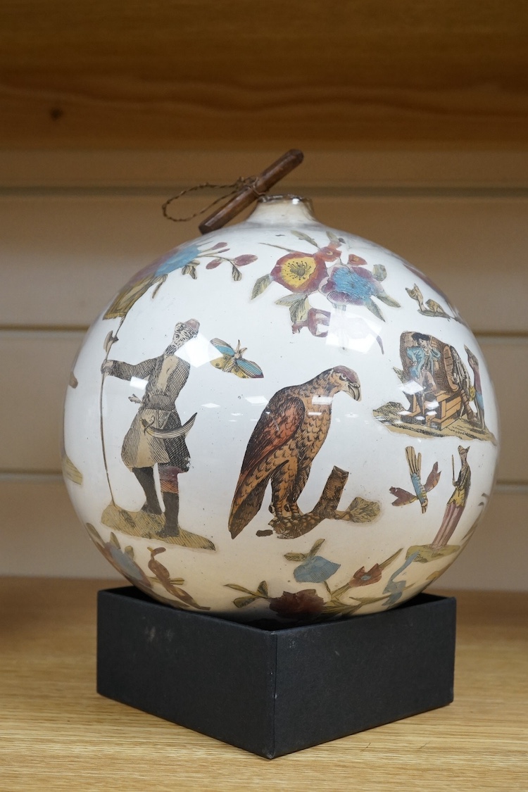 An inside decorated glass witch’s ball, 17cm in diameter. Condition - fair